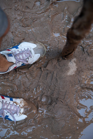 Muddy boots in a messy terrain