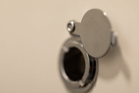 Close-up of a Metal Access Panel with Circular Opening