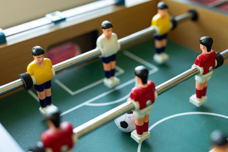Foosball Game: Close-up of Red and Yellow Players