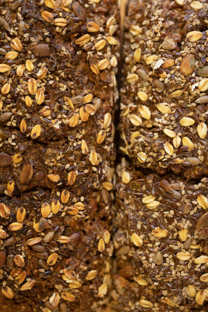 Detailed image of a rustic multigrain bread loaf, showing various seeds and grains.