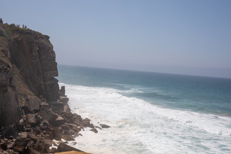 Ocean Waves Crashing Against Dramatic Cliffsの写真素材