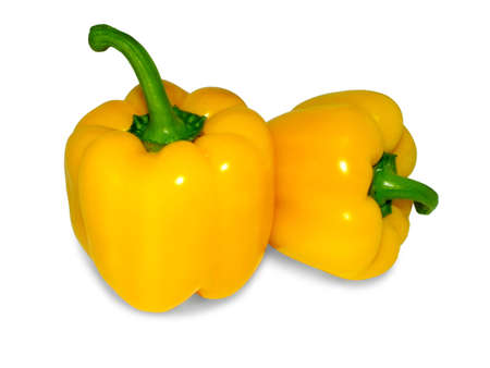 two yellow peppers isolated on white backgroundの写真素材