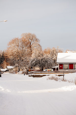 KYRKSTEN, VARMLAND-SWEDEN 12-15-2022 Winter in swedish village, red housesのeditorial素材