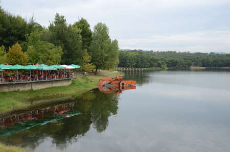 Landscape with the image of a boat on the riverの写真素材