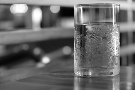 Cold water in a glass On the table,black and white.の写真素材