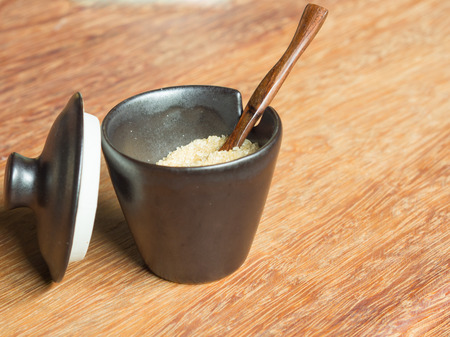 cup Red sugar on the wood table. in coffee shops.の写真素材