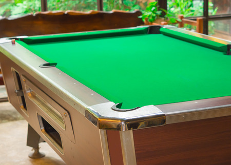 Holes pool table. in coffee shops.