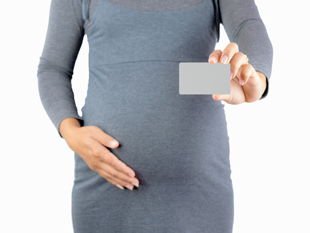 Pregnant Woman show the Credit Cards. isolated on white background. Financial concept.の写真素材