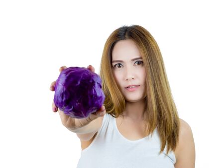 Asian Woman holding Purple cabbage, isolated on white background. Healthy Food concept.の写真素材