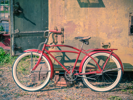 Retro vintage red bicycle. Old charming bicycle concept.の写真素材