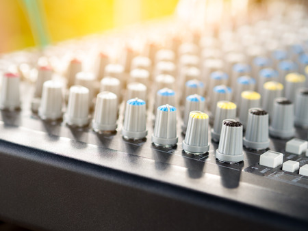 button line of audio sound mixer console. Flare light.