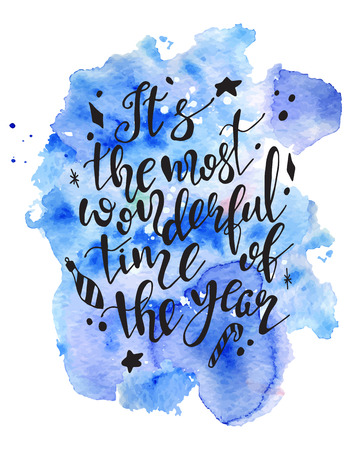 Christmas lettering hand drawn quote Its the most wonderful time of the year on colorful watercolor splash background. Print for card and prints. Vector brush calligraphy.のイラスト素材