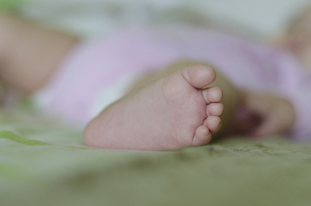 Cute tiny little baby feetの写真素材