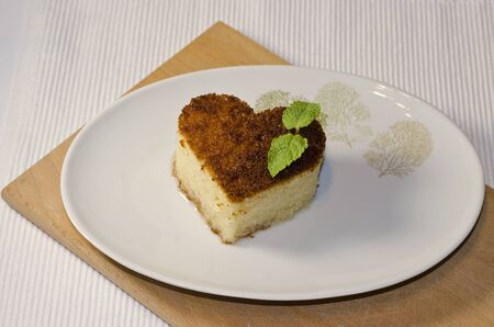 Traditional Turkish dessert revani on wooden boardの写真素材