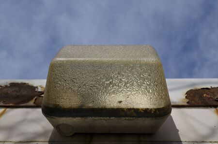 Old vintage lamp with a blue sky
