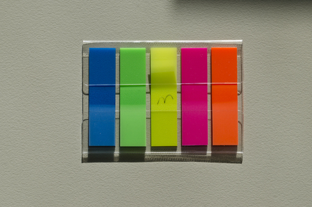 Multicolored notes in the office on the table