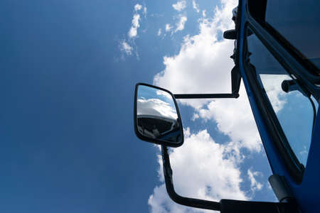 Retro side rear-view mirror on the road