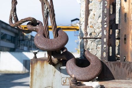 Hooks of the Big yellow lifting crane in the factoryの写真素材