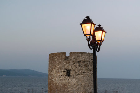 Silhouette of a street lamp in the clear morningの写真素材