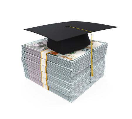 Graduation Cap on Stack of Dollar Billsの写真素材