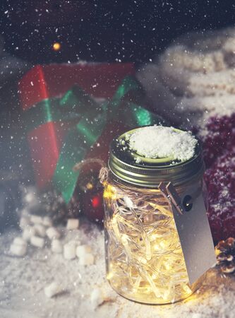 Fairy christmas holiday lights in a jar with christmas decoration, christmas or xmas conceptの写真素材