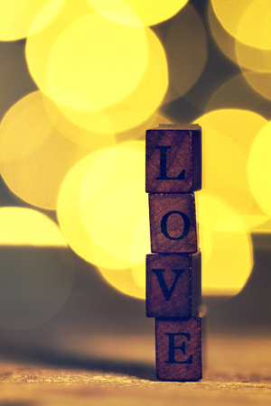Love or Valentine's Day Concept with Wooden Letters LOVE on a wooden background.の写真素材