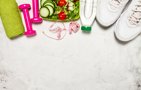 Healthy lifestyle, food, sport or athlete's equipment on bright background. Flat lay. Top view with copy space.の写真素材