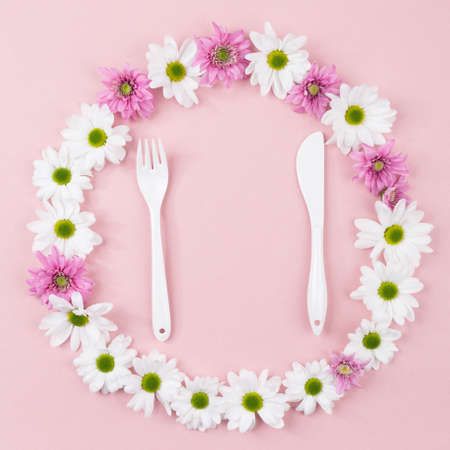 From above dinnerware and plate made of purple and white flowers.の写真素材