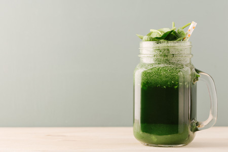 Green refreshing drink in glass jar on a table.の写真素材