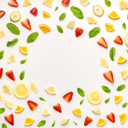 Flat lay of chaotic seamless background with slices of fresh citrus and strawberry in composition...