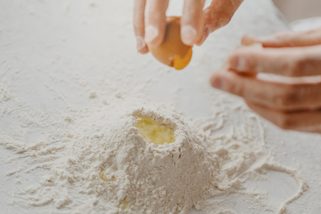 Closeup of process of making cooking homemade pasta. Chef make fresh italian traditional pastaの写真素材