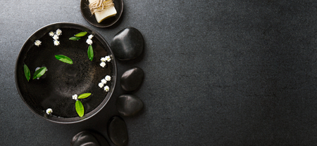 Spa Wellness Relax concept. Spa background with spa accessories on dark background. View from above with copy space.の写真素材