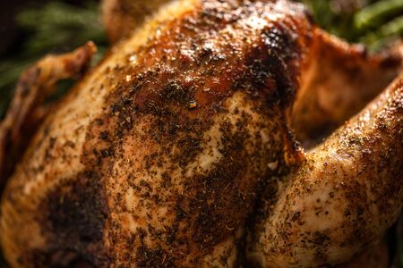 Closeup of tasty baked poultry turkey with rosemary. Thanksgiving or Christmas food.の写真素材