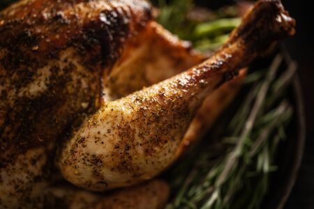 Closeup of tasty baked poultry turkey with rosemary. Thanksgiving or Christmas food.の写真素材