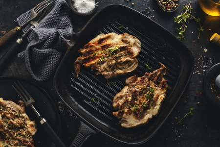Fresh grilled meat pork slices grilled on pan with spices. Top view.の写真素材