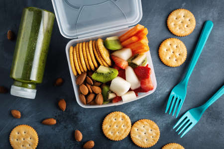 Lunch to go with fruits and vegetables in box. View from above.の写真素材