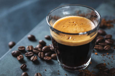 Closeup of classic fresh espresso served on dark background.の写真素材