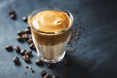 Trendy coffee drink Dalgona with milk and whipped foam made from instant coffee and sugar.の写真素材