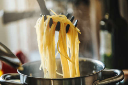 Closeup of boiling spaghetti pasta in pot.の写真素材