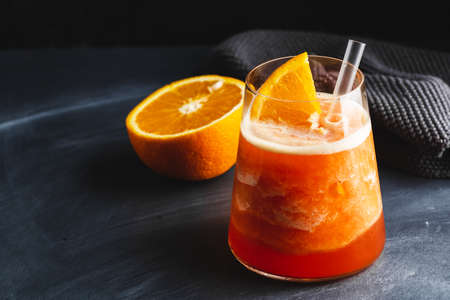 Tasty sweet freshmade refreshing summer cocktail with oranges and mint served in glass. Closeup