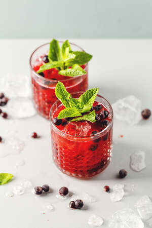 Tasty freshmade drink cocktail with blackberry and mint. Served in glasses. Closeupの写真素材