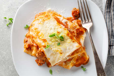 Tasty appetizing lasagna served on plate on table. Closeupの写真素材