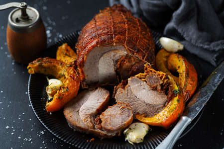 Baked loaf of turkey with spices and pumpkin. Closeup.の写真素材