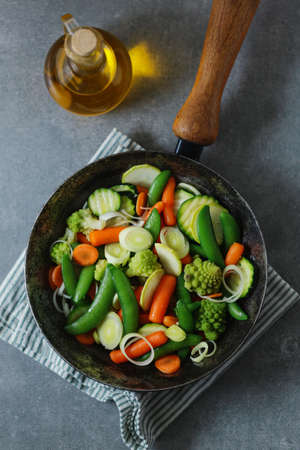Vegan vegetables on pan fried or ready for cooking on table. Closeup. Selective focusの写真素材