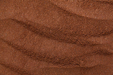 Coffee background. Coffee automatic from machine with ground coffee on coffee background.の写真素材