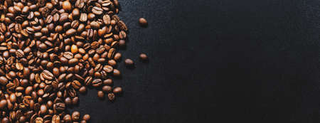 Coffee beans on dark background. Top view. Coffee concept. Banner.の写真素材