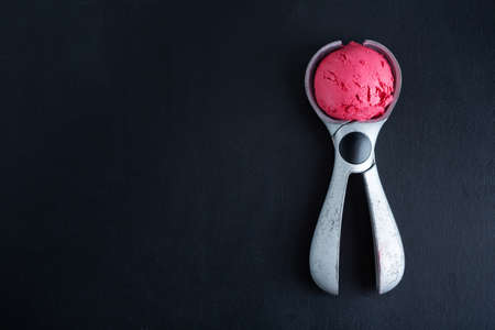 Fruity strawberry Ice cream scoop on ice cream spoon. Top view.の写真素材