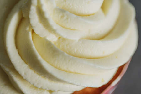 Vanilla cupcakes with cream. Closeup