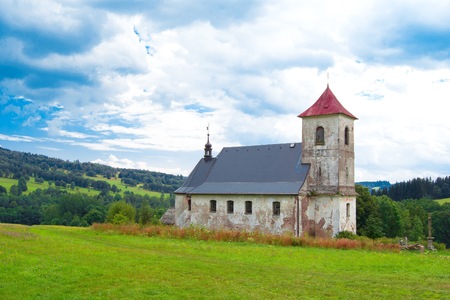 Small church in mountains with nice background.の写真素材