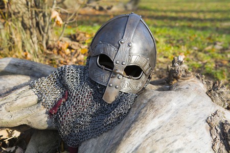 Old forged Viking helmet on a leaf.の写真素材